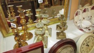 3 pairs of brass candlesticks