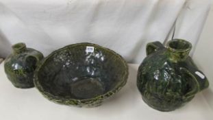 A pottery bowl and 2 carafe's