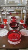 A mixed lot of red glass items