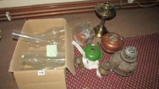 A quantity of oil lamp parts and chimneys