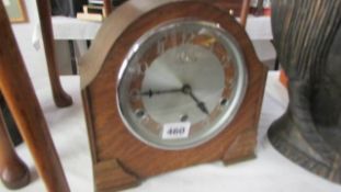 An oak mantel clock