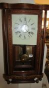 A Victorian inlaid wall clock