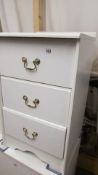 A white 3 drawer bedside chest