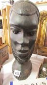 A carved hard wood African bust