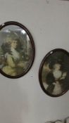 A pair of oval portrait prints