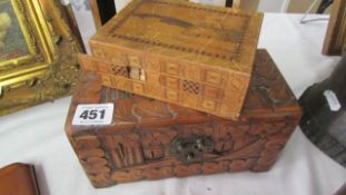 A carved box and a puzzle box