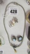 A pearl drop pendant and 2 pairs of earrings