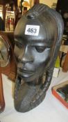 A carved hard wood African bust