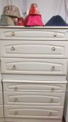 A pair of white 3 drawer chests