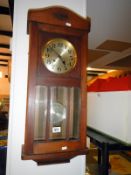 An oak 1920s wall clock