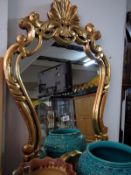 A wall mirror in gilt frame