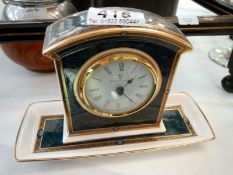 A Royal Doulton clock on tray