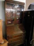 A bureau with bookcase