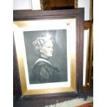 An engraving of a lady in oak frame