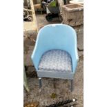 A blue wicker bedroom chair