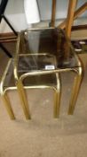 2 brass glass topped side tables
