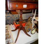 A mahogany tripod table with drawer