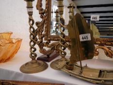 A pair of Victorian brass twisted candlesticks and brass junk