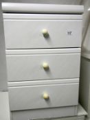 A 3 drawer white chest of drawers