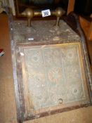 A Victorian coal box with brass front