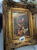 A picture of chickens in gilt frame