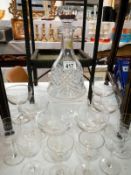 A cut glass decanter and 2 sets of glass