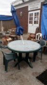 A garden table, 2 chairs & a parasol