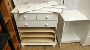 A 2 over 4 white chest of drawers