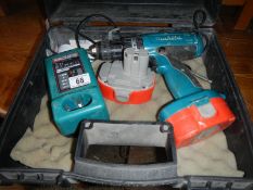 A cordless drill with charger and batter packs (working)