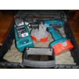 A cordless drill with charger and batter packs (working)