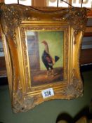 A picture of a bird in a gilt frame