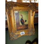 A picture of a bird in a gilt frame
