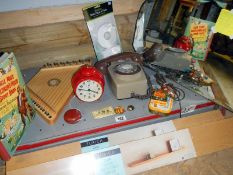 A shelf of mixed items including clock, zither & mirror etc.
