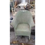 A green wicker bedroom chair