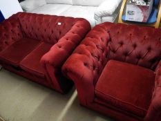 A red deep buttoned 2 seater and 1 seater suite