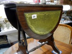 A small drop leaf leather top side table