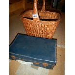 An old suitcase and wicker basket