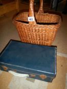 An old suitcase and wicker basket