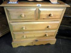 A 2 over 2 pine chest of drawers