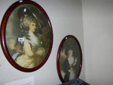A pair of old oval pictures of ladies
