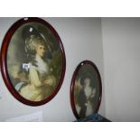 A pair of old oval pictures of ladies