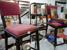 A pair of good black hall chairs