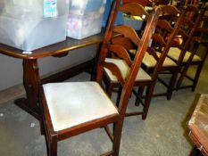 An oak refectory table & 4 chairs