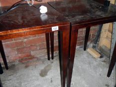 A pair of mahogany tables