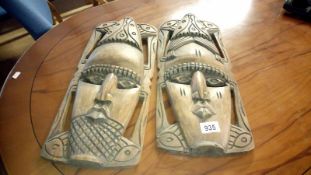 2 oak tribal masks