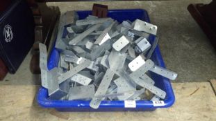 A quantity of joist hangers