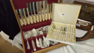 A box of cutlery and another