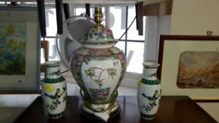 An Oriental lamp base and 2 vases