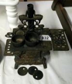 A cast iron miniature stove