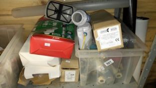 A box of plumbing fittings, cistern parts etc